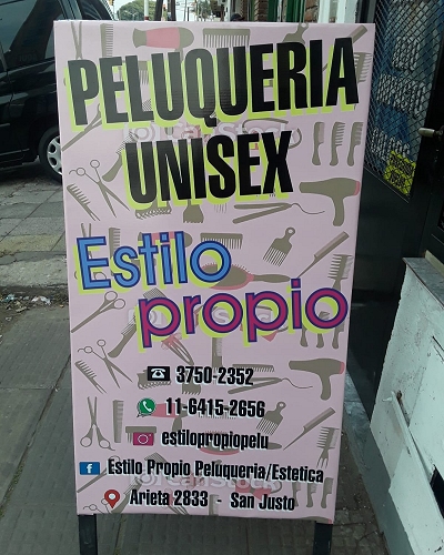 cartel publicitario tipo libro para vereda PELUQUERIA en zona oeste